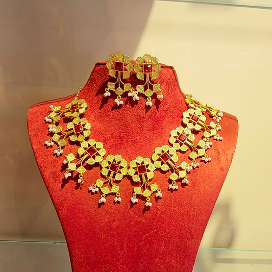 KERALA Gold floral jewelry set with red square accents and small white bead drops,